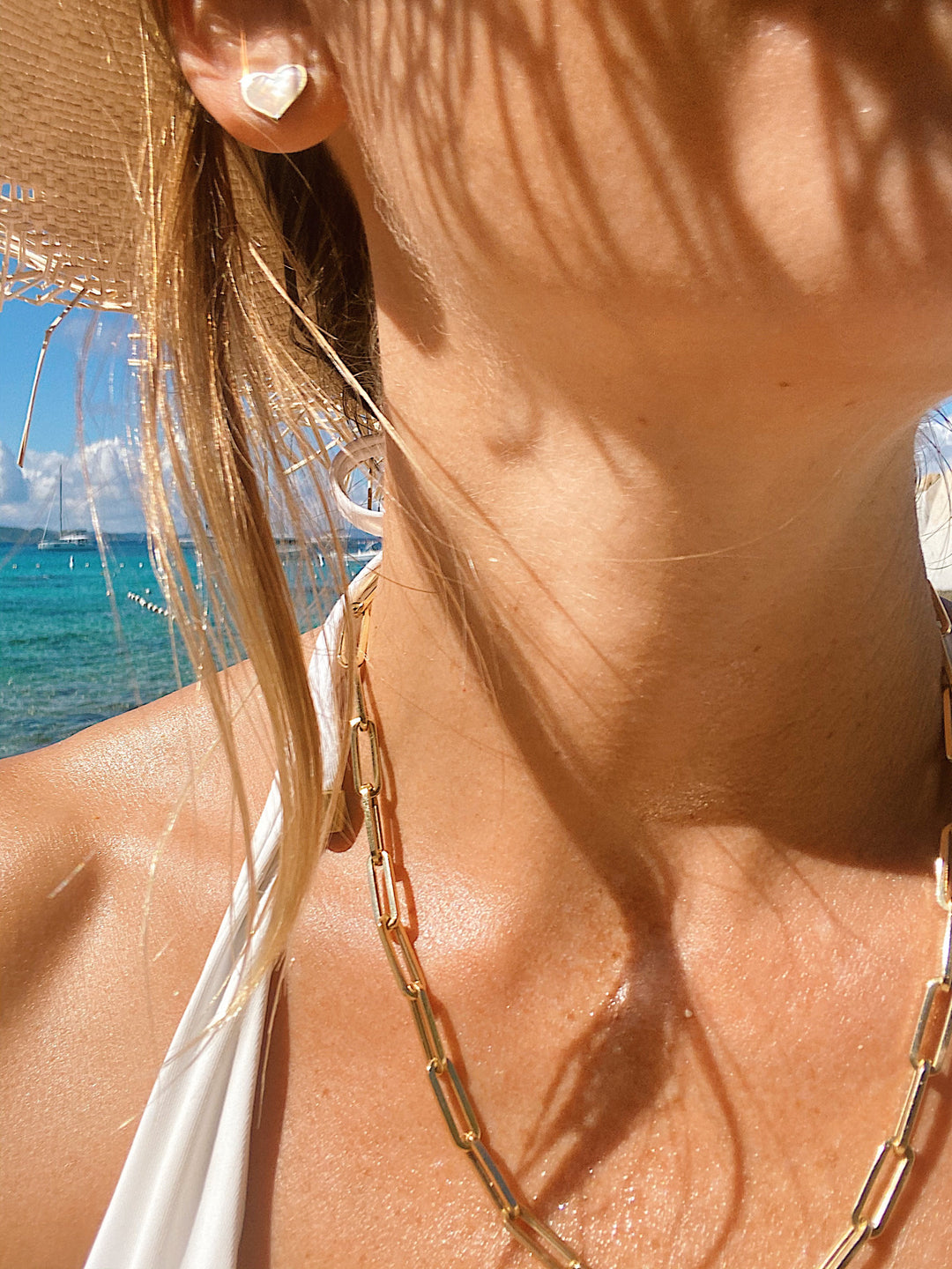 14 kt. gold large paperclip chain necklace on model at the beach